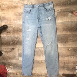 ripped light wash blue jeans